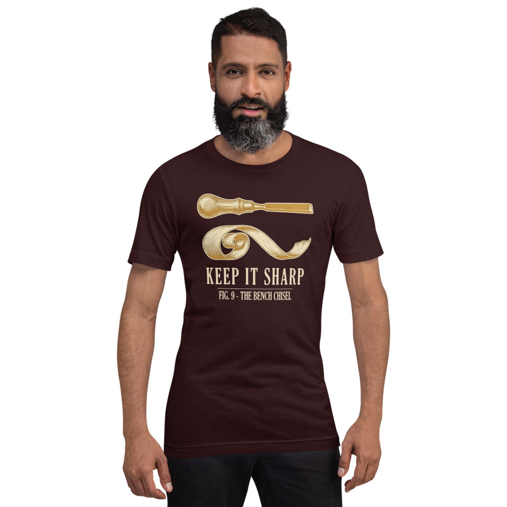 Keep It Sharp woodworking tee — Oxblood Black, on model