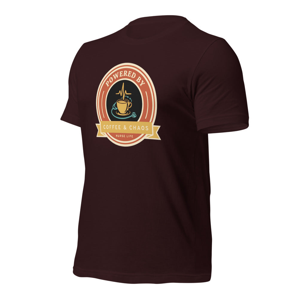 Powered by Coffee & Chaos retro nurse badge tee — Oxblood Black, front-right