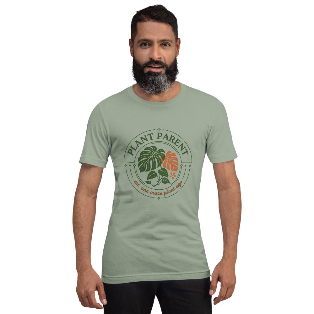 Model wearing the Plant Parent retro botanical badge tee — Sage