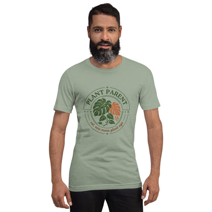 Model wearing the Plant Parent retro botanical badge tee — Sage