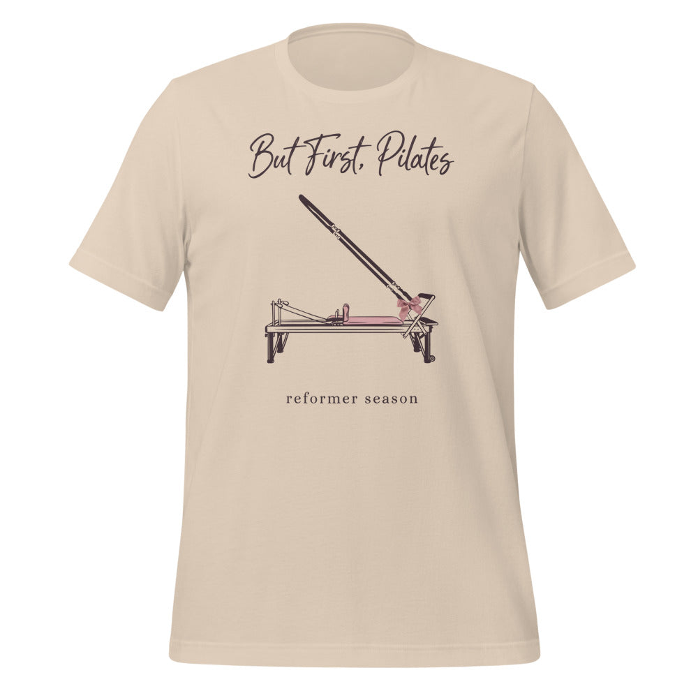 But First Pilates reformer line-art tee — Soft Cream, front