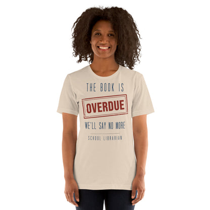 The Book Is Overdue funny school librarian t-shirt — Soft Cream, on model