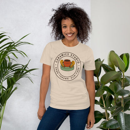 Ceramics Studio Badge hand-thrown pottery t-shirt — Soft Cream, on model