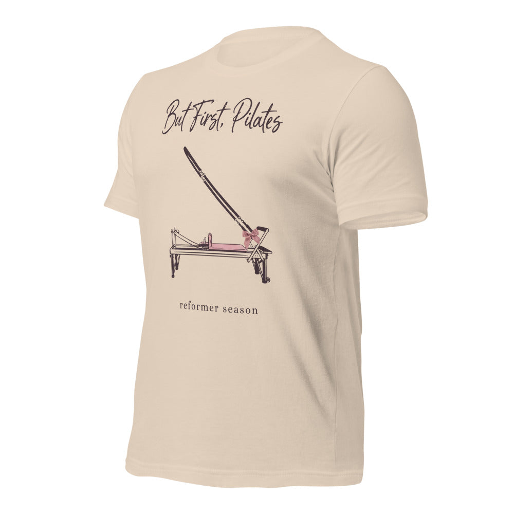 But First Pilates reformer line-art tee — Soft Cream, front-right