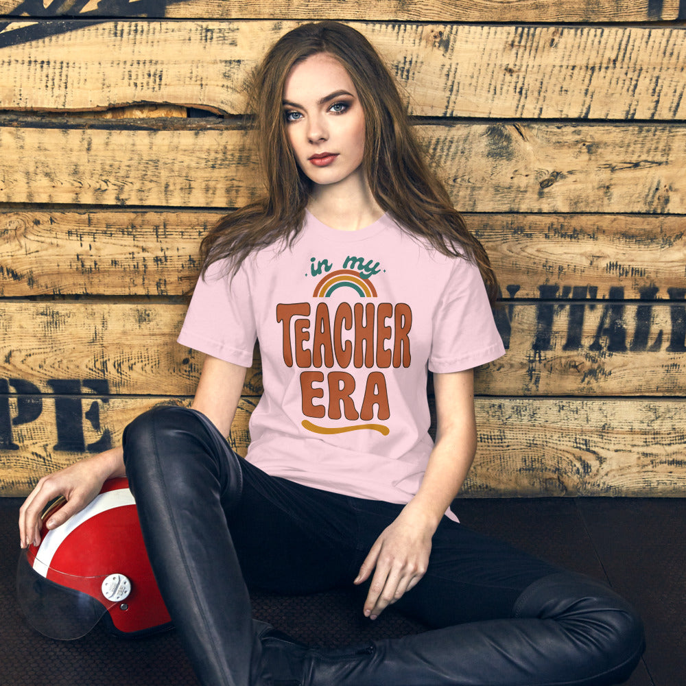 In My Teacher Era retro groovy teacher tee — Soft Pink, on model