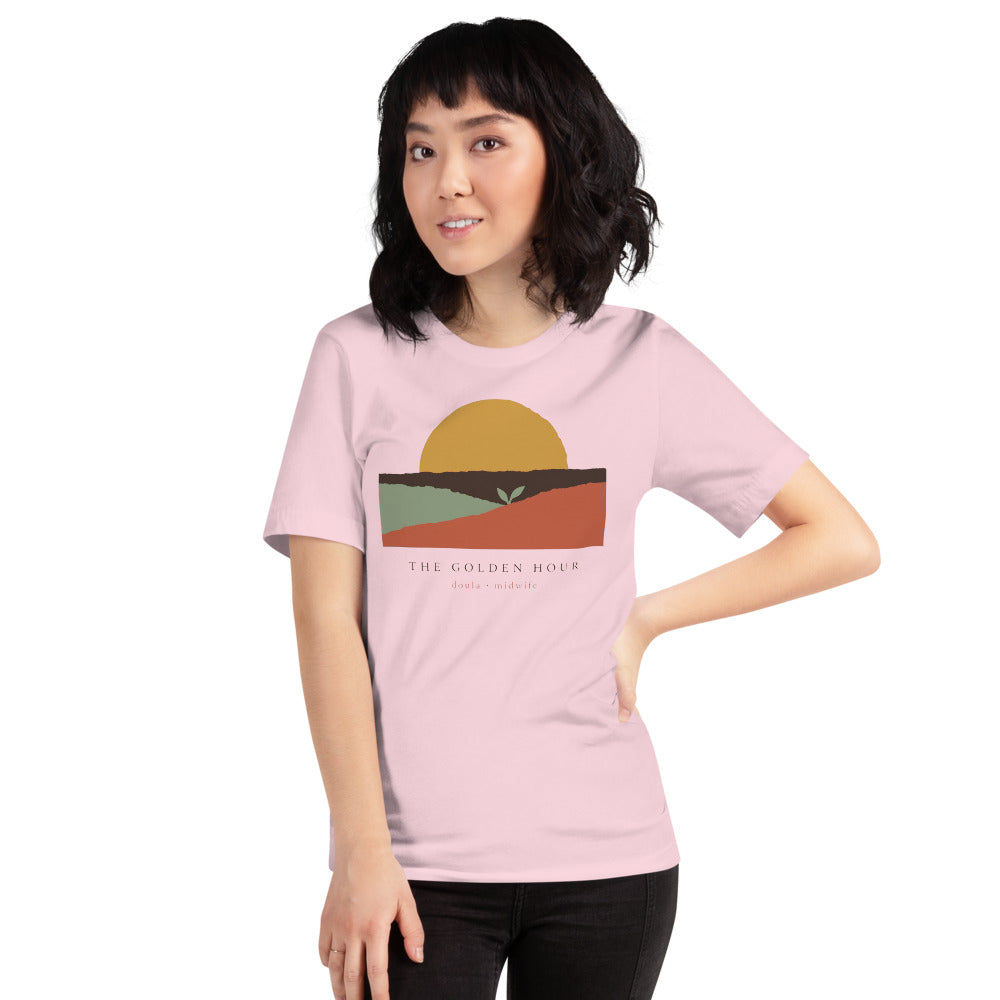 The Golden Hour birth worker doula t-shirt — Soft Pink, on model