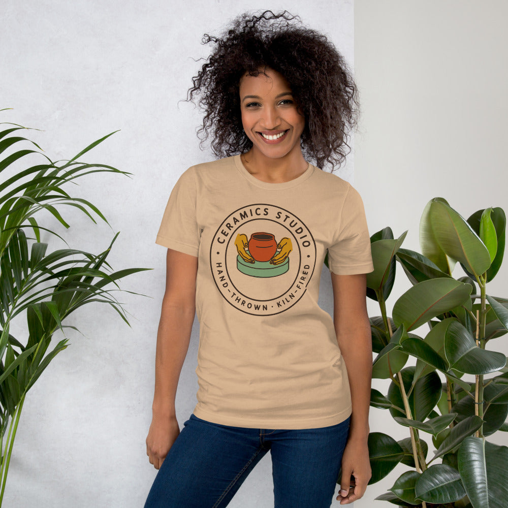 Ceramics Studio Badge hand-thrown pottery t-shirt — Tan, on model