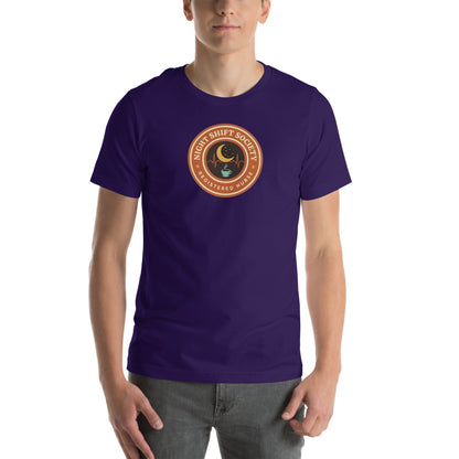 Night Shift Society retro registered nurse badge tee — Team Purple, on model