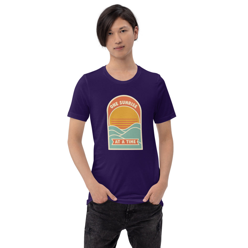 One Sunrise at a Time retro sunrise tee — Team Purple, on model