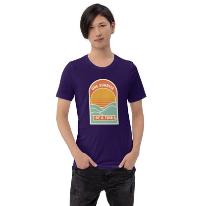 One Sunrise at a Time retro sunrise tee — Team Purple, on model