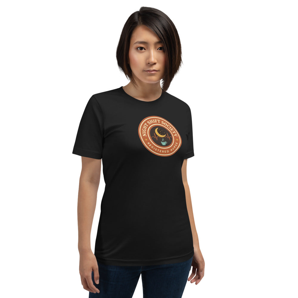 Night Shift Society retro registered nurse badge tee — Vintage Black, on model