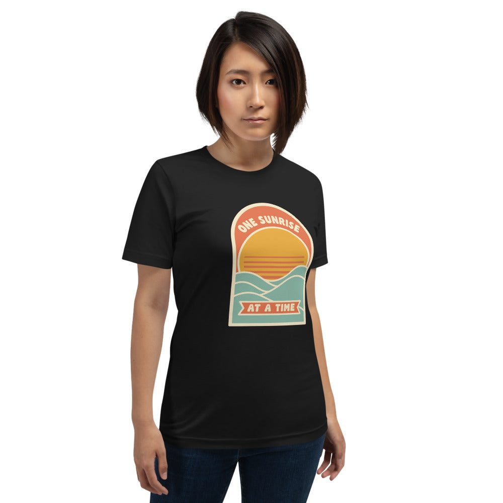 One Sunrise at a Time retro sunrise tee — Vintage Black, on model