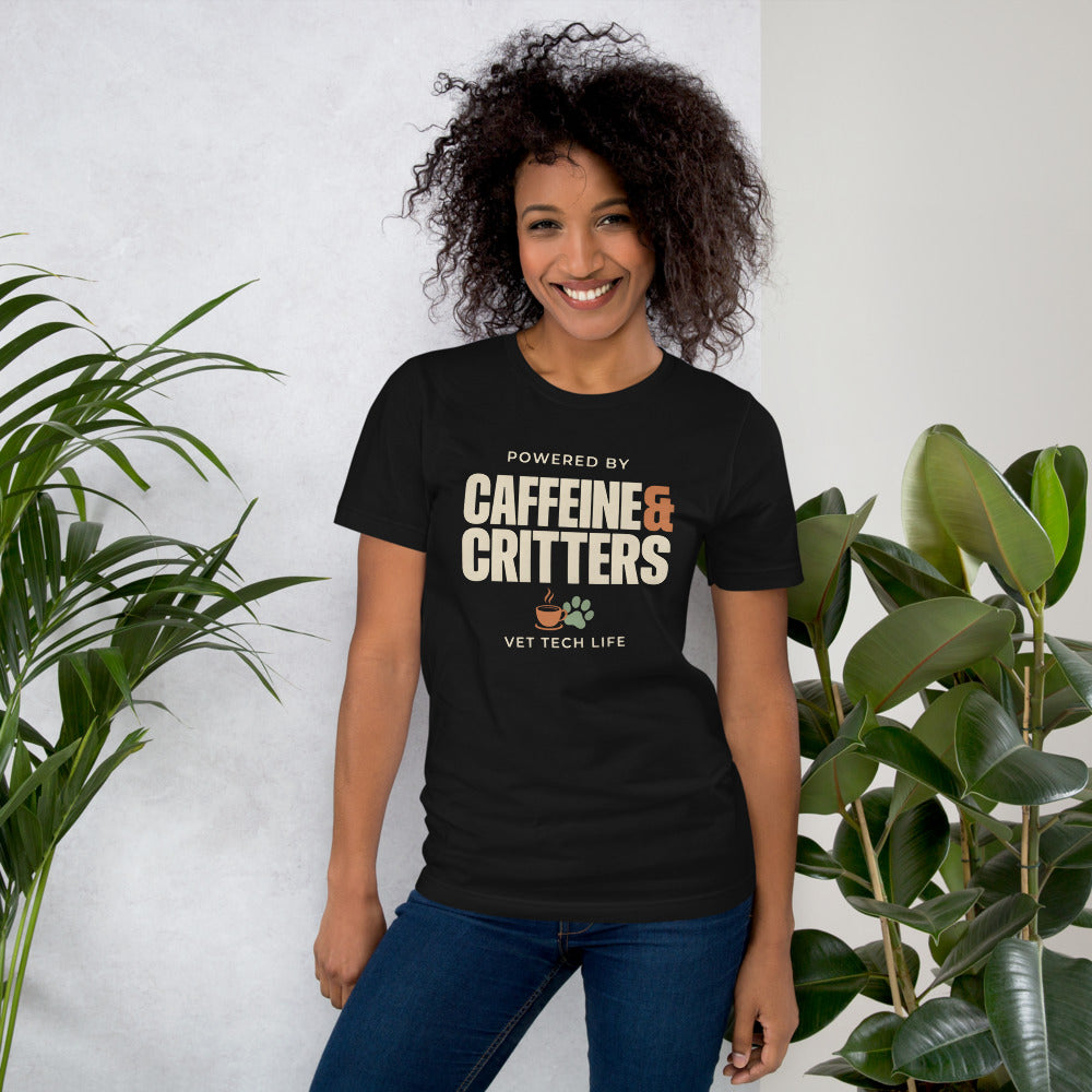 Powered by Caffeine & Critters funny vet tech tee — Vintage Black, on model
