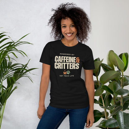 Powered by Caffeine & Critters funny vet tech tee — Vintage Black, on model