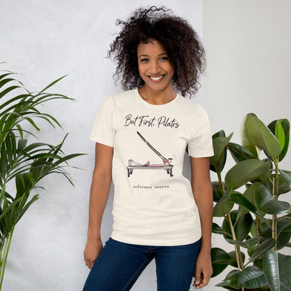 But First Pilates reformer line-art tee — Vintage White, on model