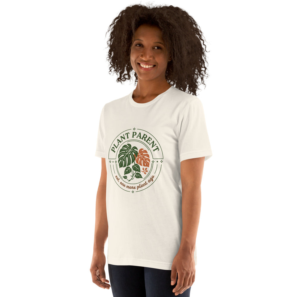 Model wearing the Plant Parent retro botanical badge tee — Vintage White