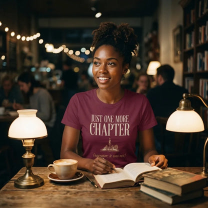 Just One More Chapter book lover dark academia tee — woman reading at a cafe table, Maroon